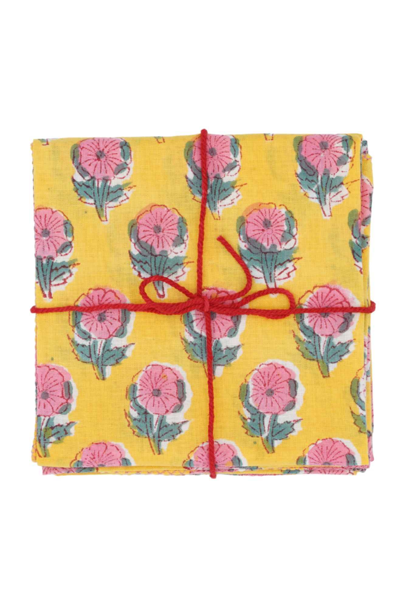 Suzette Cotton Napkins Helenium Lemon folded and tied with a red string.
