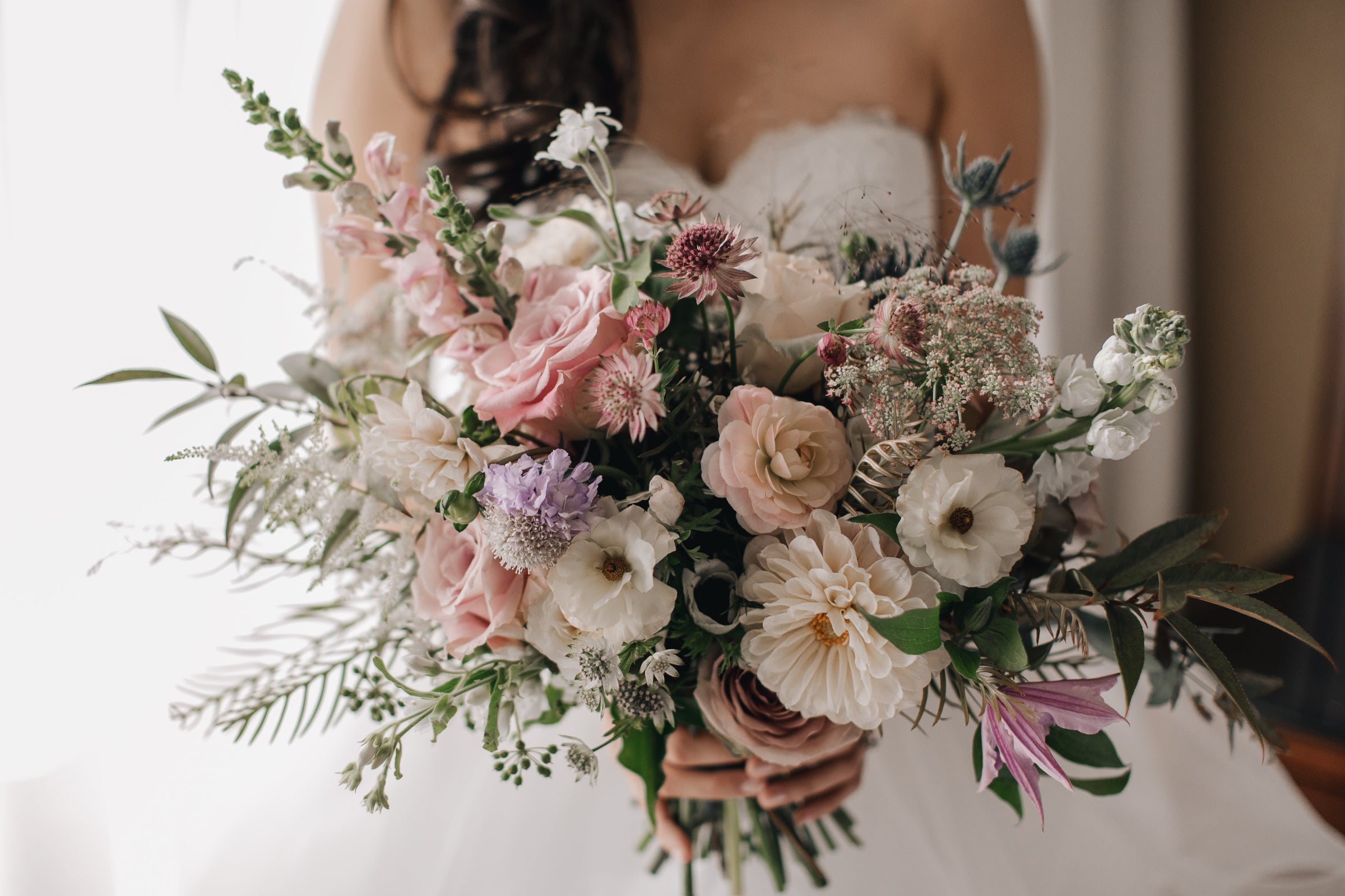 Sprout-home soft floral bridal bouquet in soft whites and pastels. Photograph by Deep End Imagery