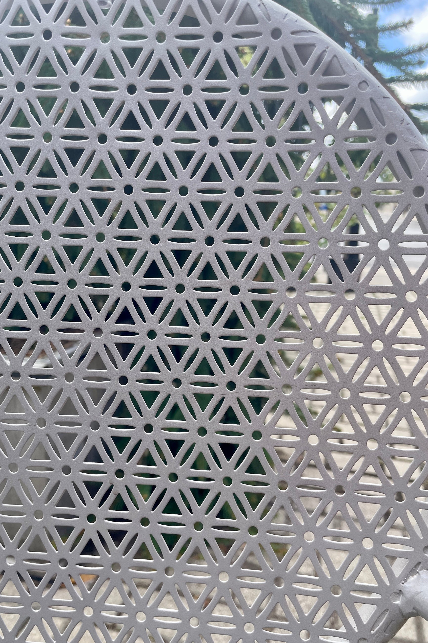 Detail of the metal work of the gray bistro chair at Sprout-home. 