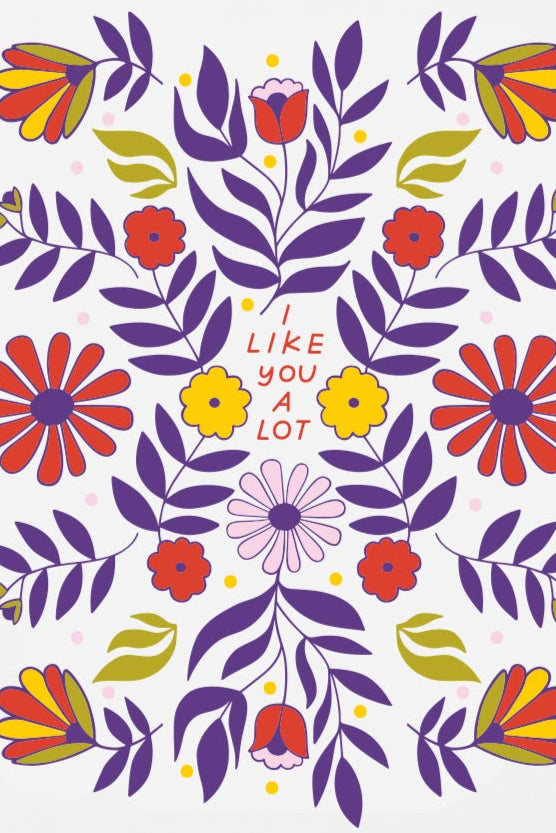 A floral pattern greeting card of mostly blue red and yellow with central text that reads "I like you a lot."