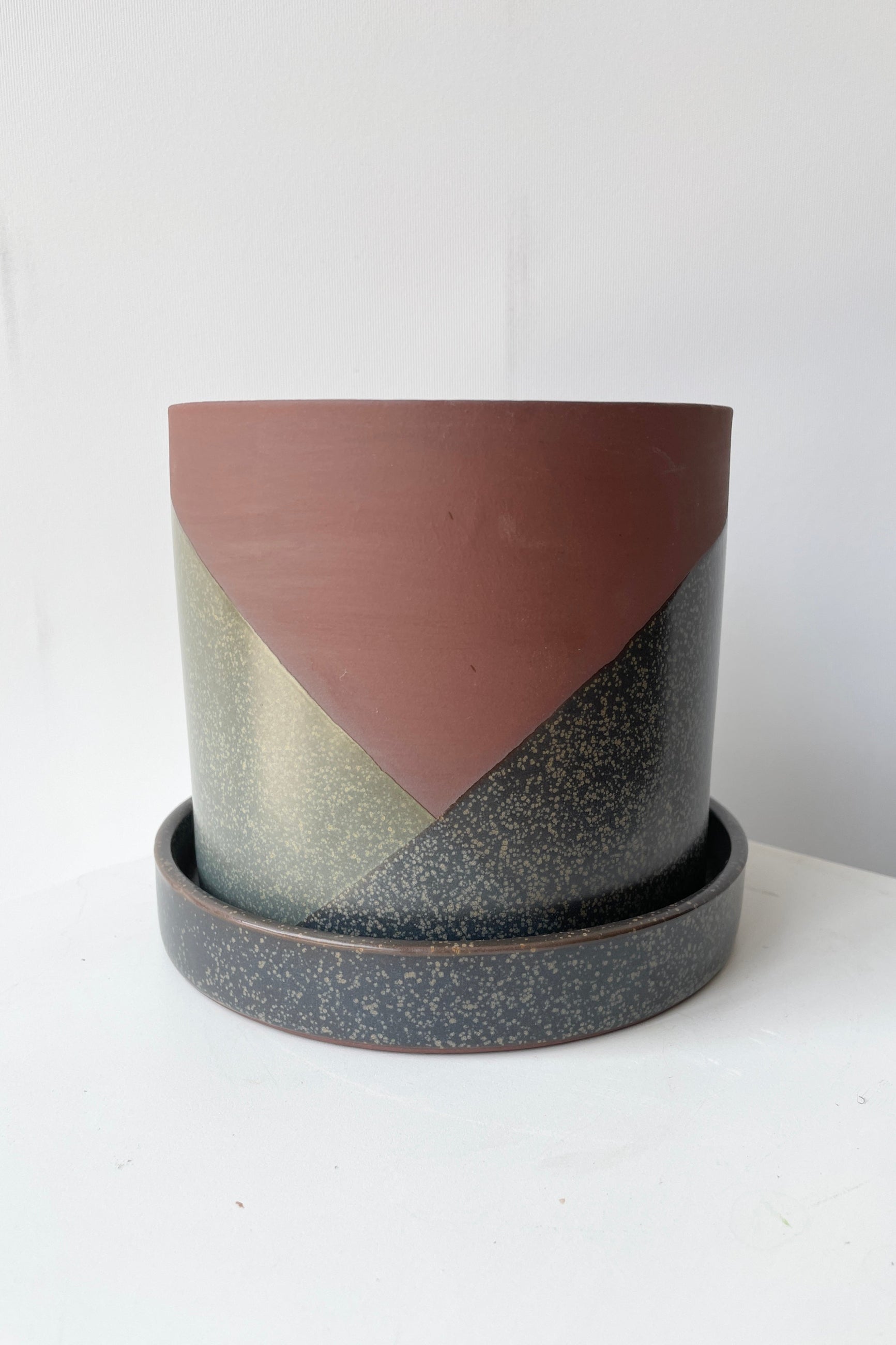El Cerro pot small empty shown at eye level against a white wall ©Sprout Home