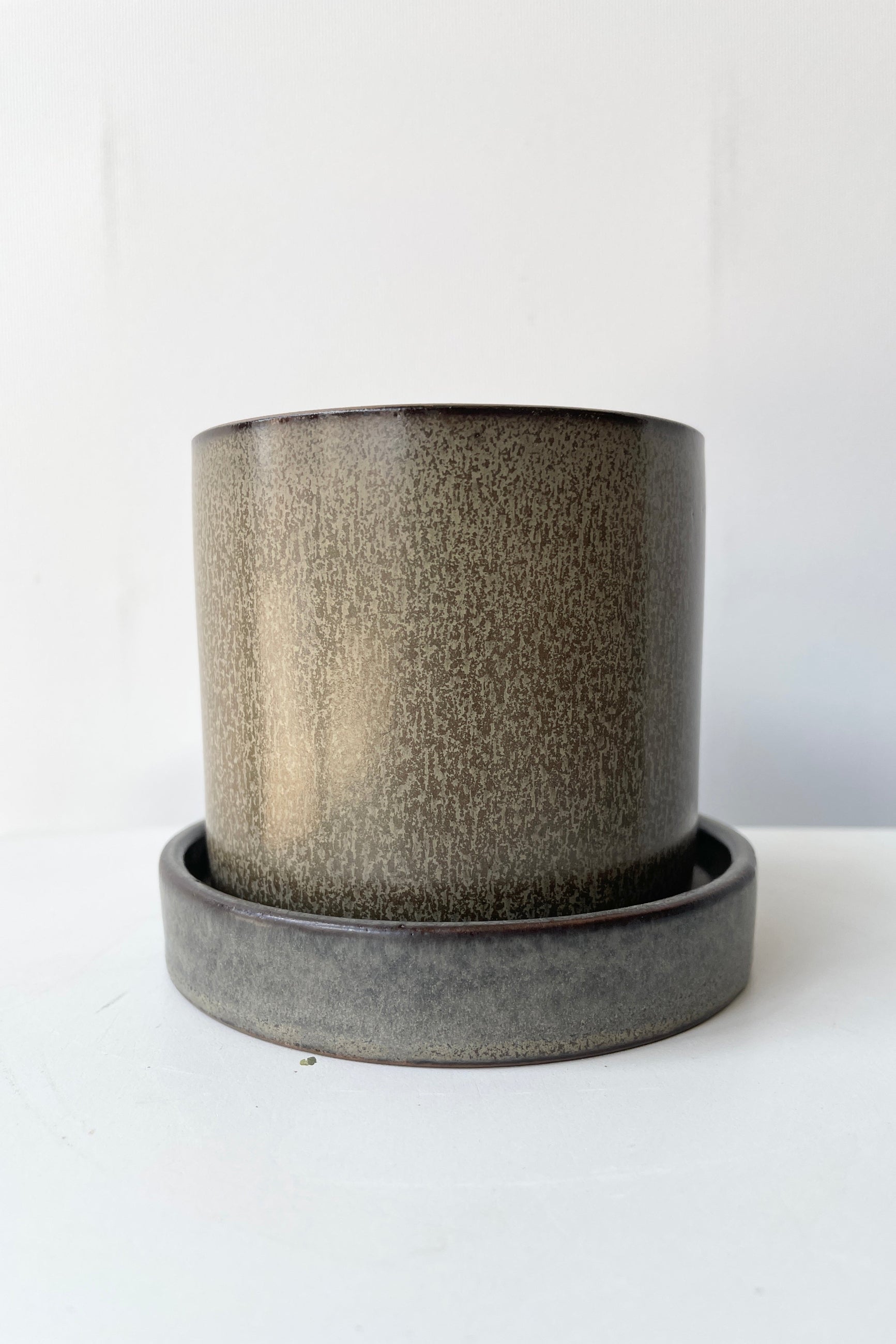 Hawthorne brown pot and saucer shown at eye level from the side ©Sprout Home