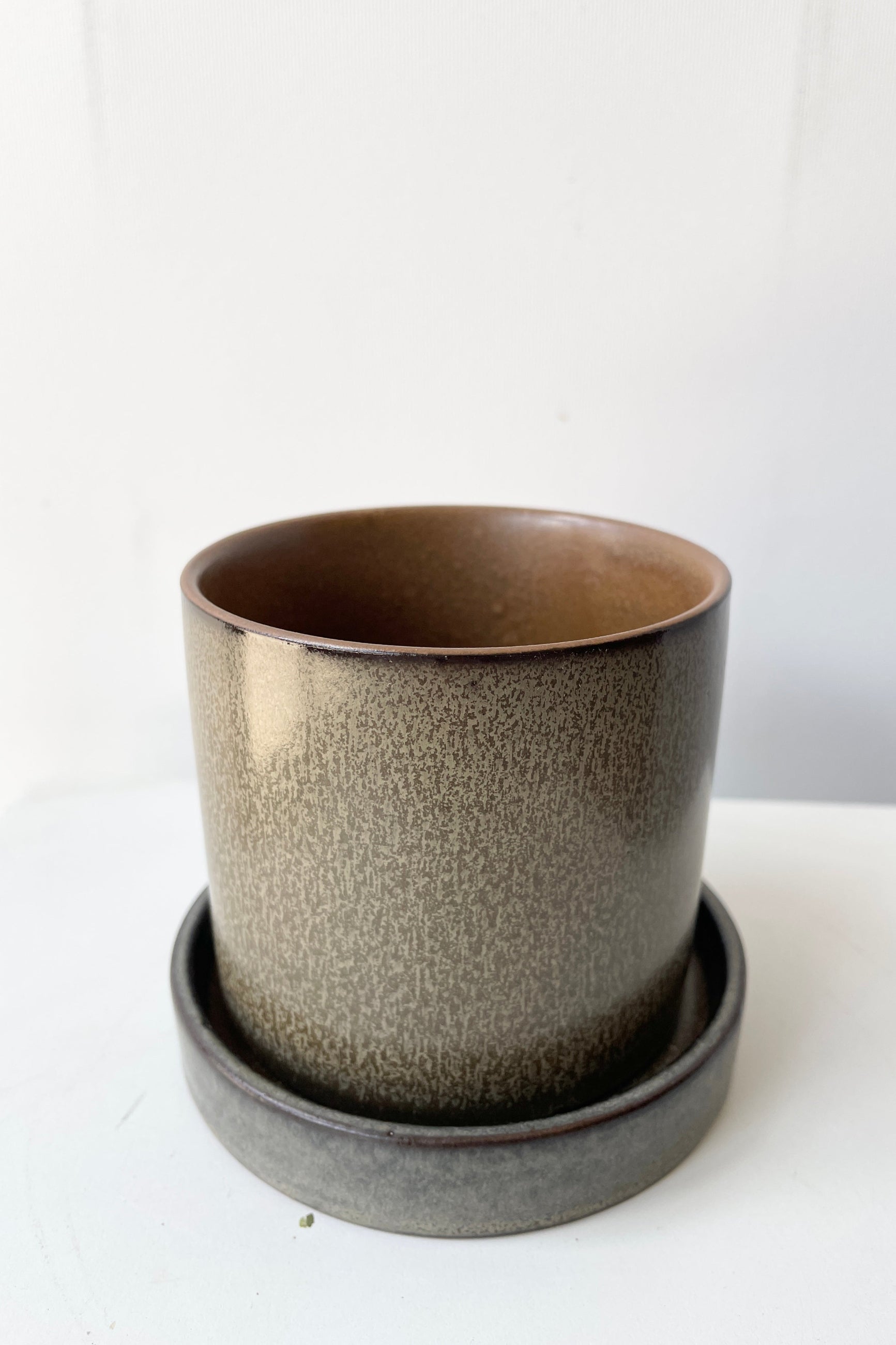 Hawthorne brown pot and saucer shown from the top side looking slightly in ©Sprout Home