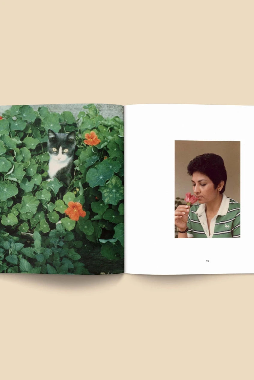Forgotten Flowers Coffee Table Book by Broccoli  open to pages with a cat in Nasturtiums and a vintage photo