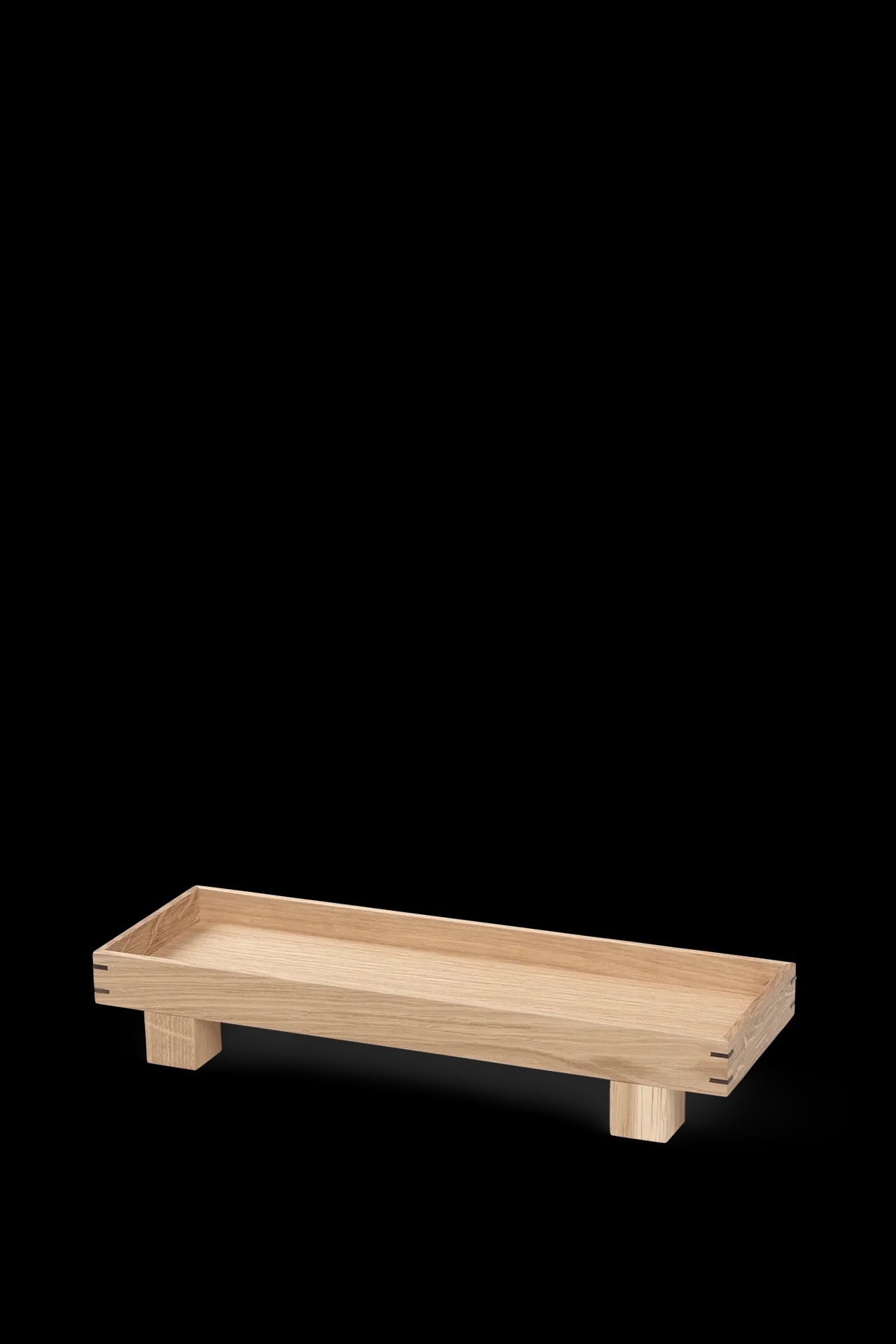 Bon Wooden Tray Oak XS on a black backdrop ©Ferm Living