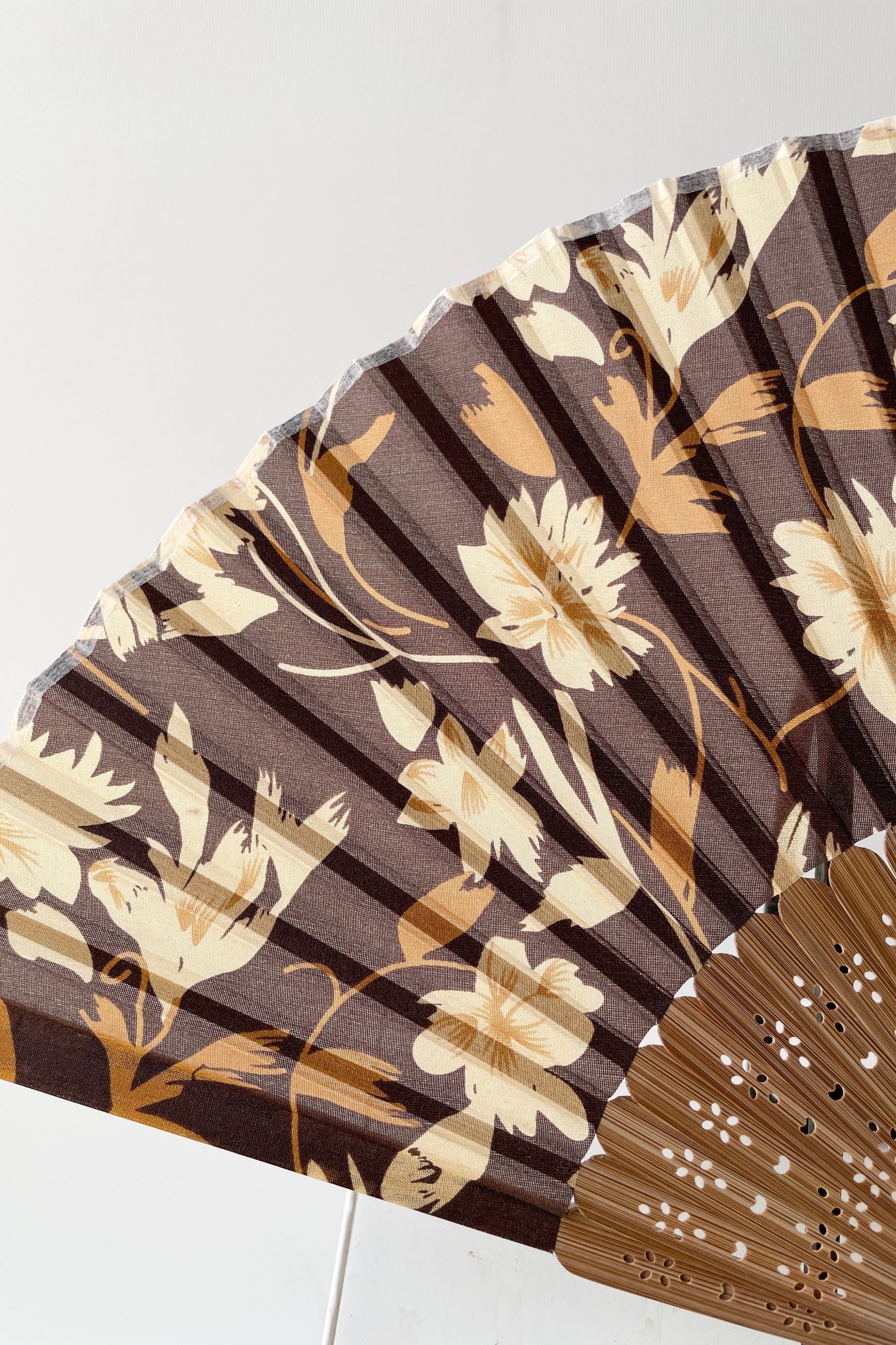 Detail of the silk brown flowers and bamboo on the silk fan at Sprout-home. 