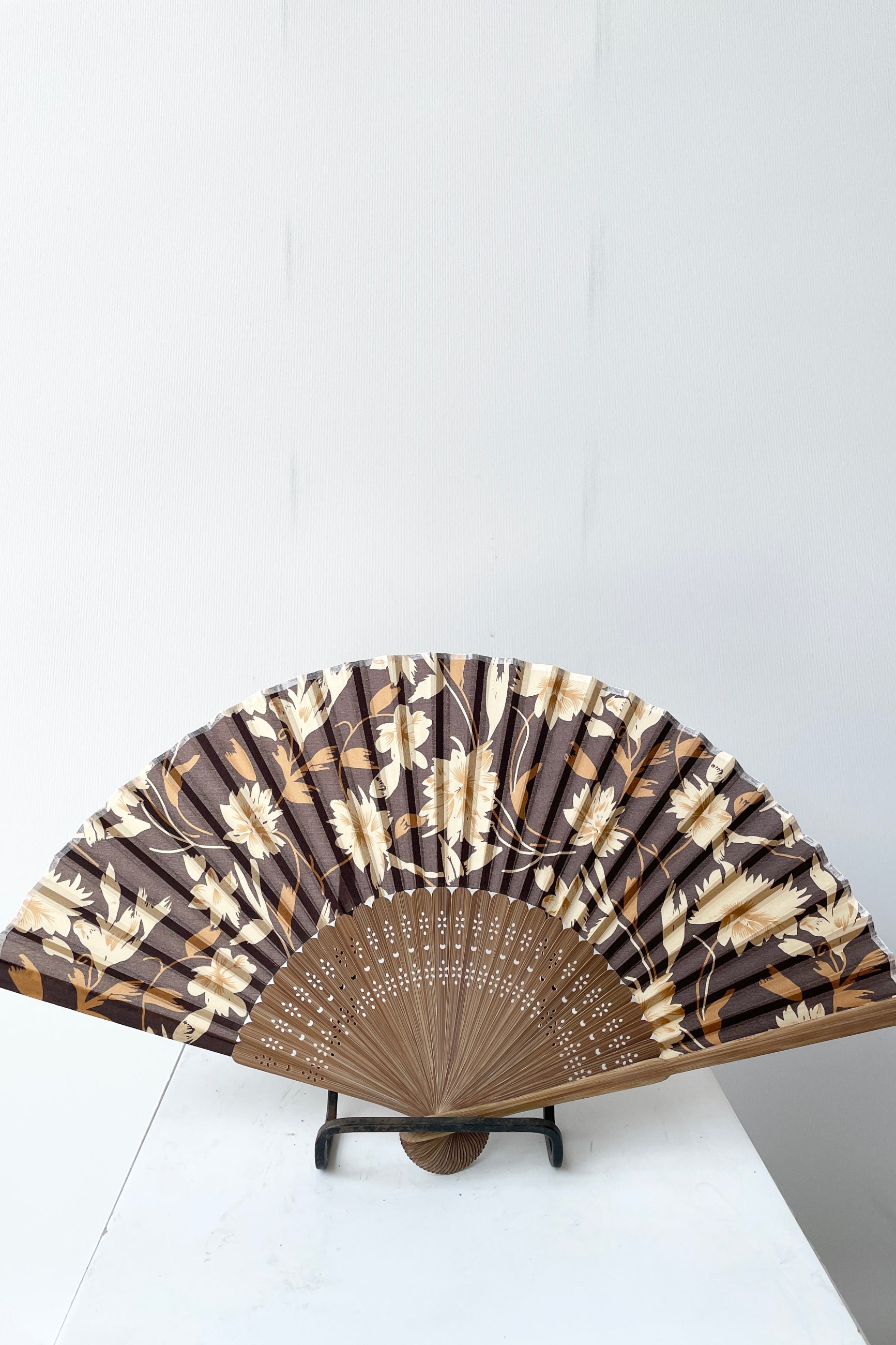 Silk fan brown flower and brown bamboo open and on a stand at Sprout-home. 