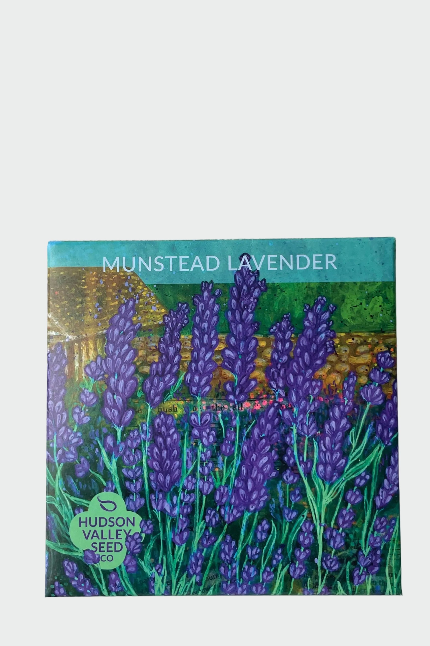 A packet of Munstead Lavender seeds by Hudson Valley Seed Co. shown from the front with the beautiful art pack drawing