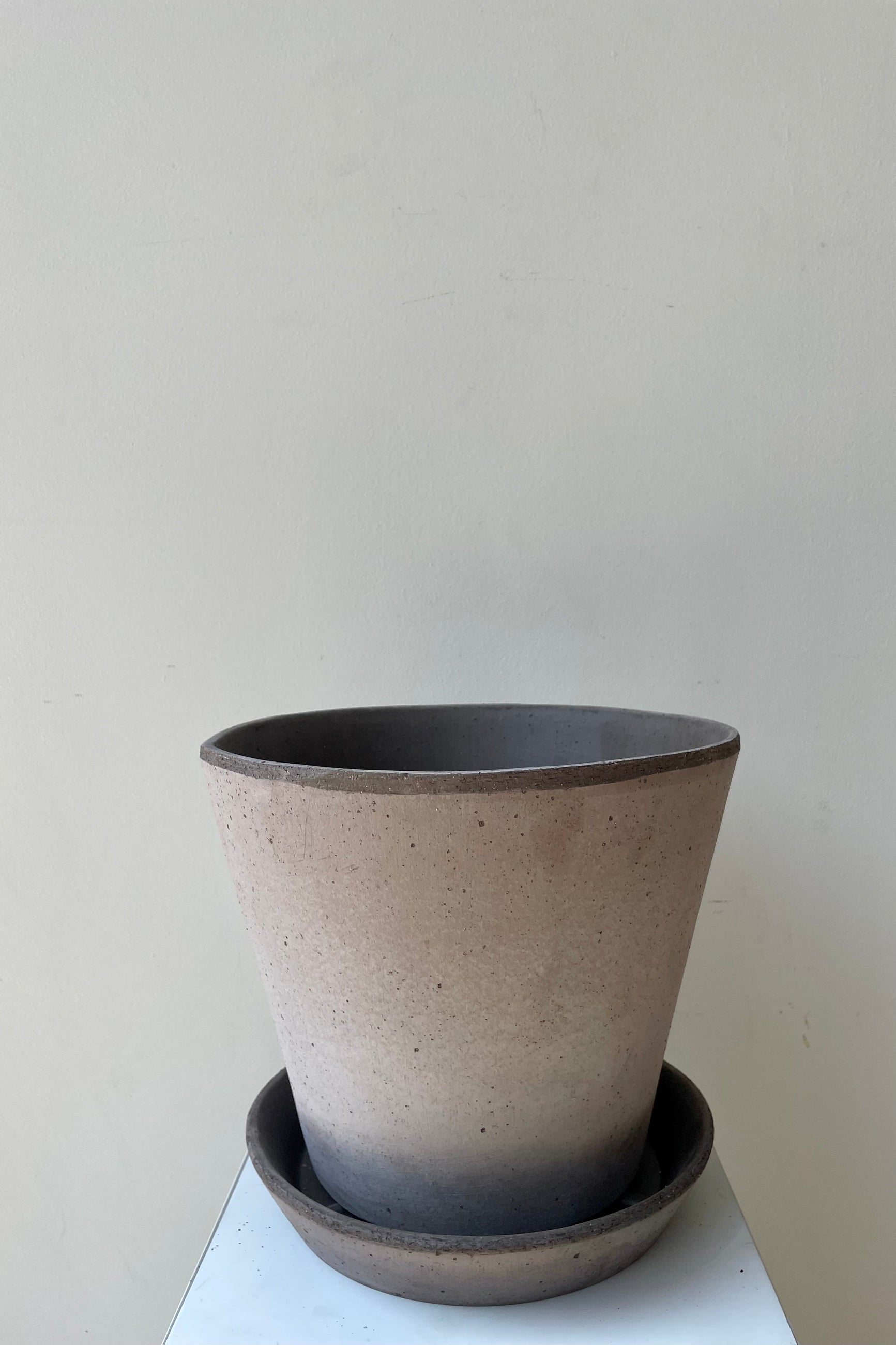 Julie Pot & Saucer grey 9.8” against a white wall