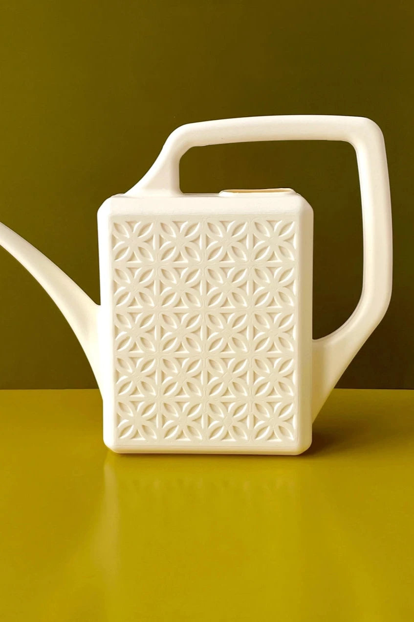 The Breeze Block watering can in Ivory on a green background by Jungle Club