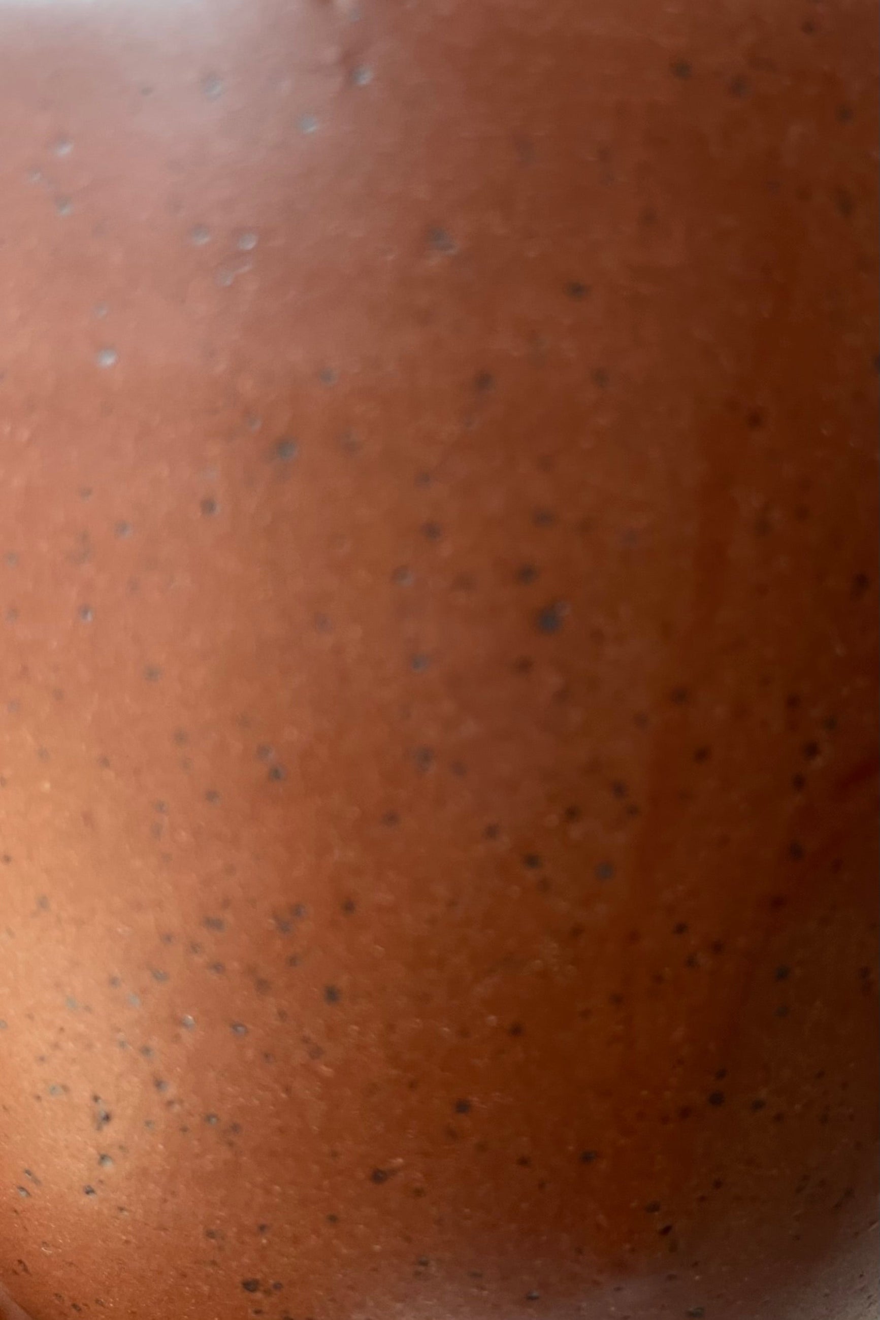 up close picture of the Chocolate Speckle finish on the Tabletop planter and saucer. 