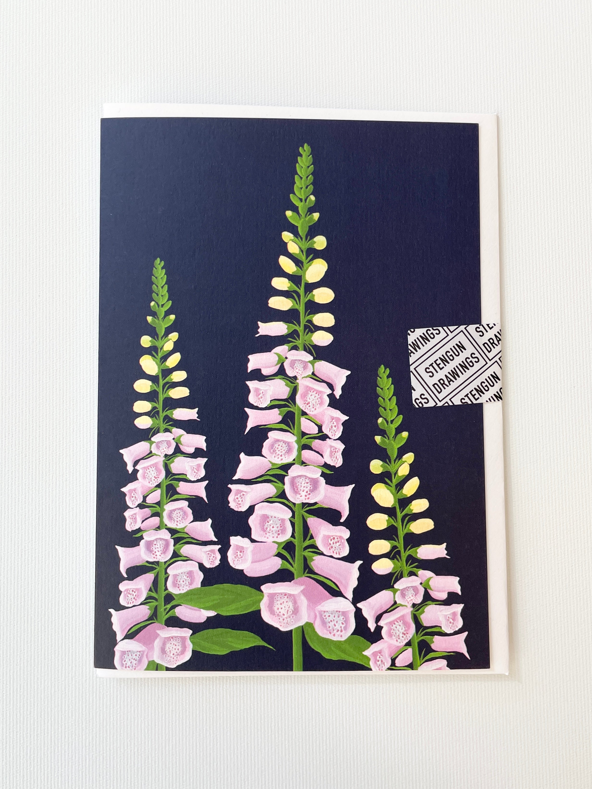 The Foxglove greeting card by Stengun showing the dark blue background and purple foxglove
