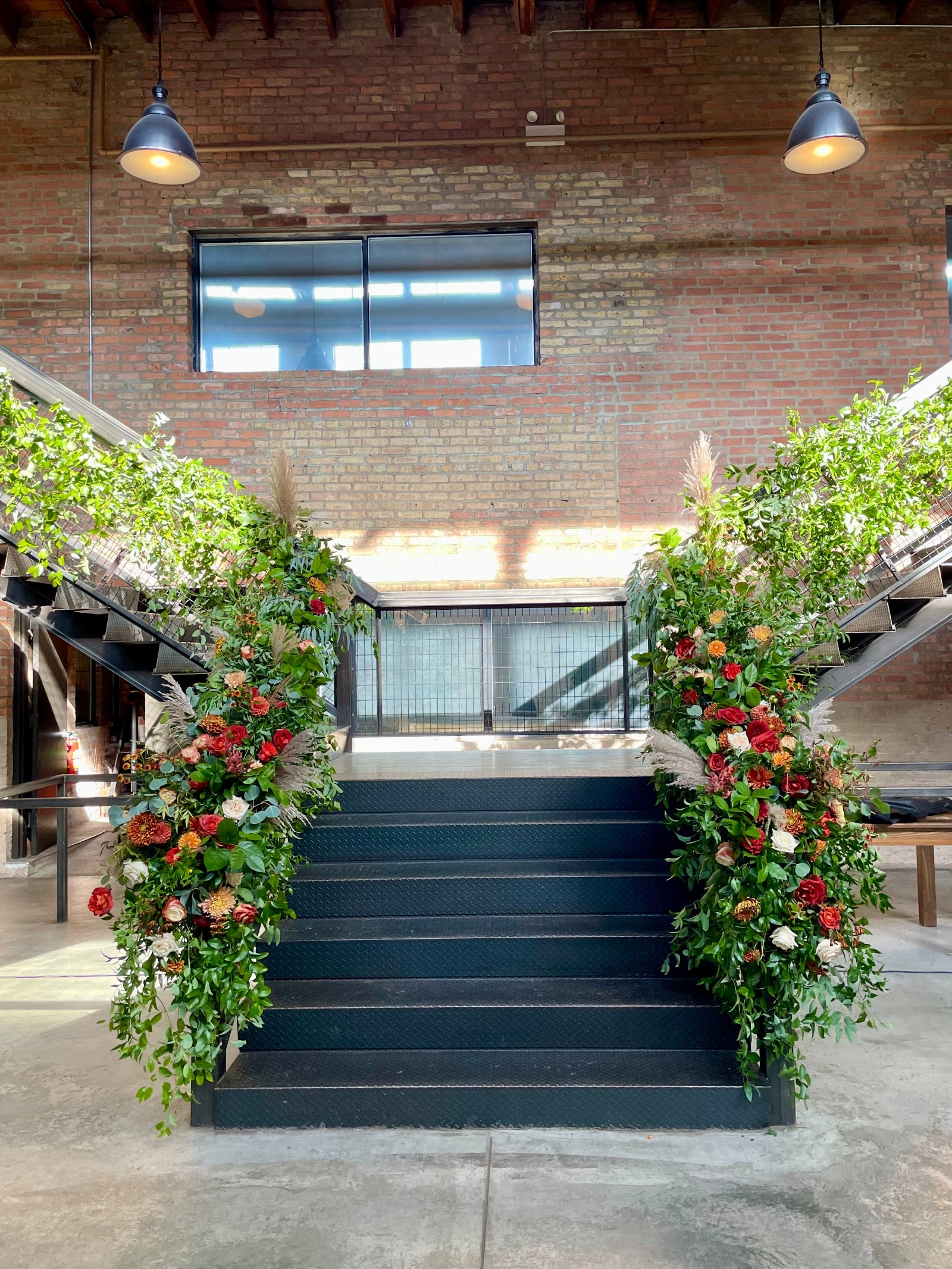 Sam & Kwaku's wedding staircase as the Ainslie in Chicago, floral by Sprout-home. 