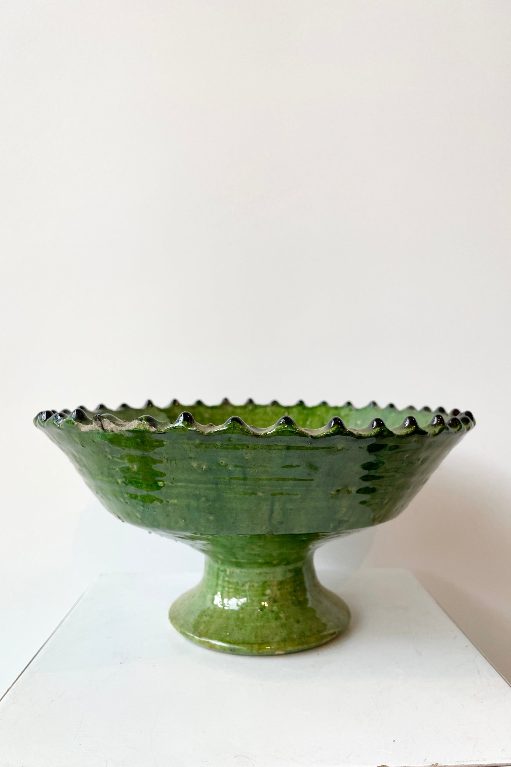 The Medium Tamegroute Green Compote at Sprout-home against a white wall. 
