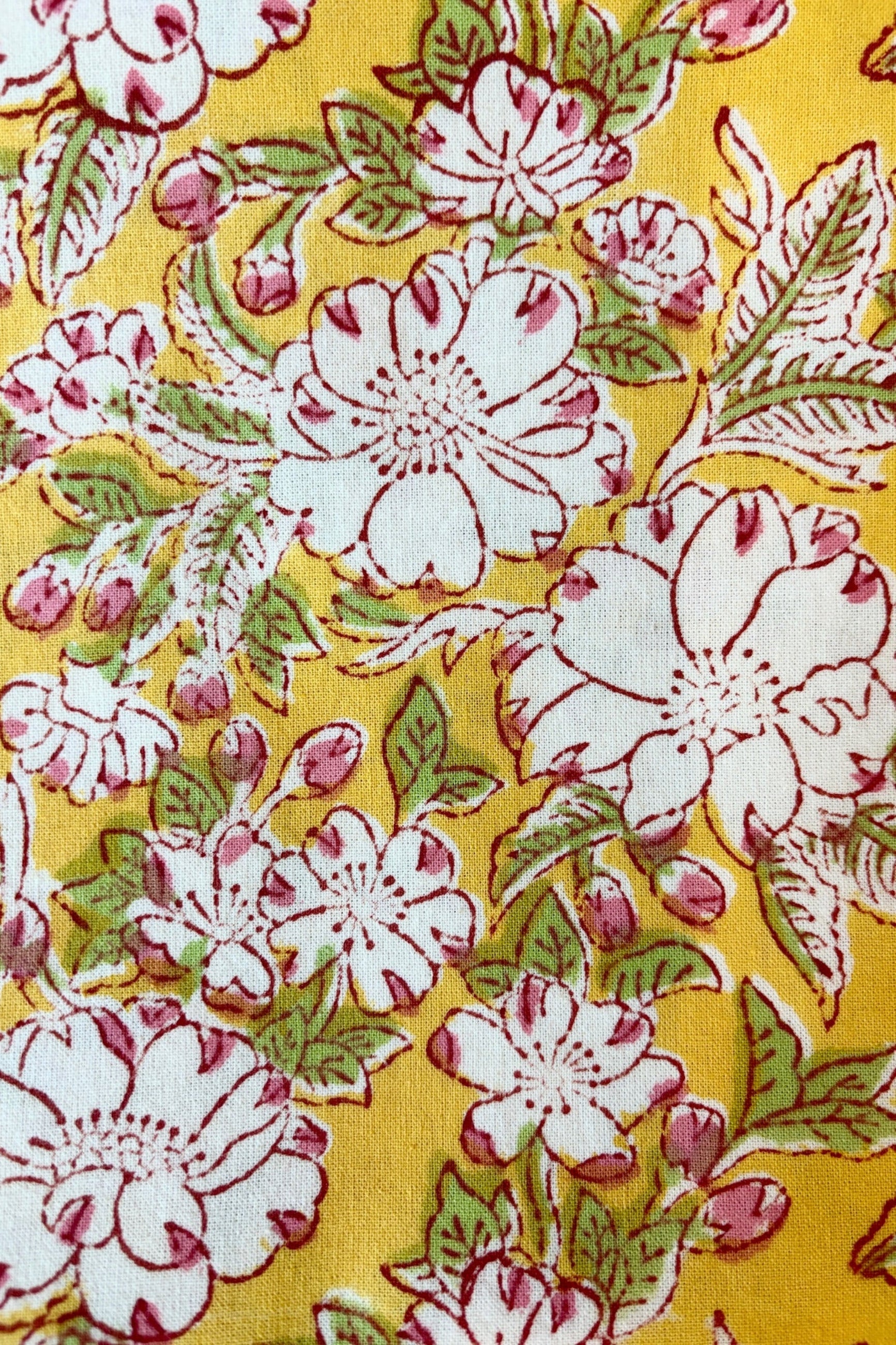 Detail of Camelia  yellow and pink floral print tablecloth ©Sprout Home