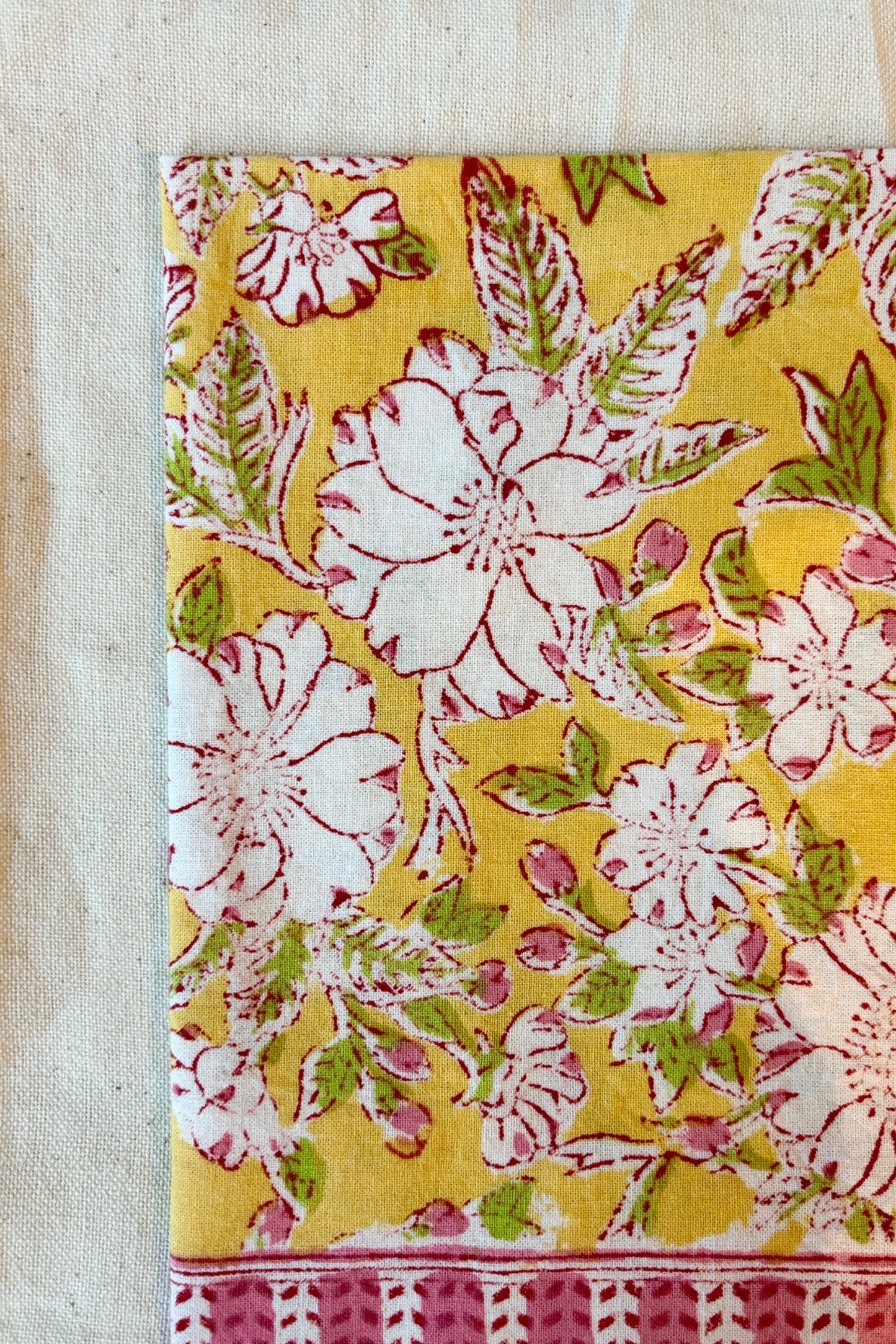 Hand printed, 100% cotton Camelia  yellow and pink floral print tablecloth with natural napkin ©Sprout Home