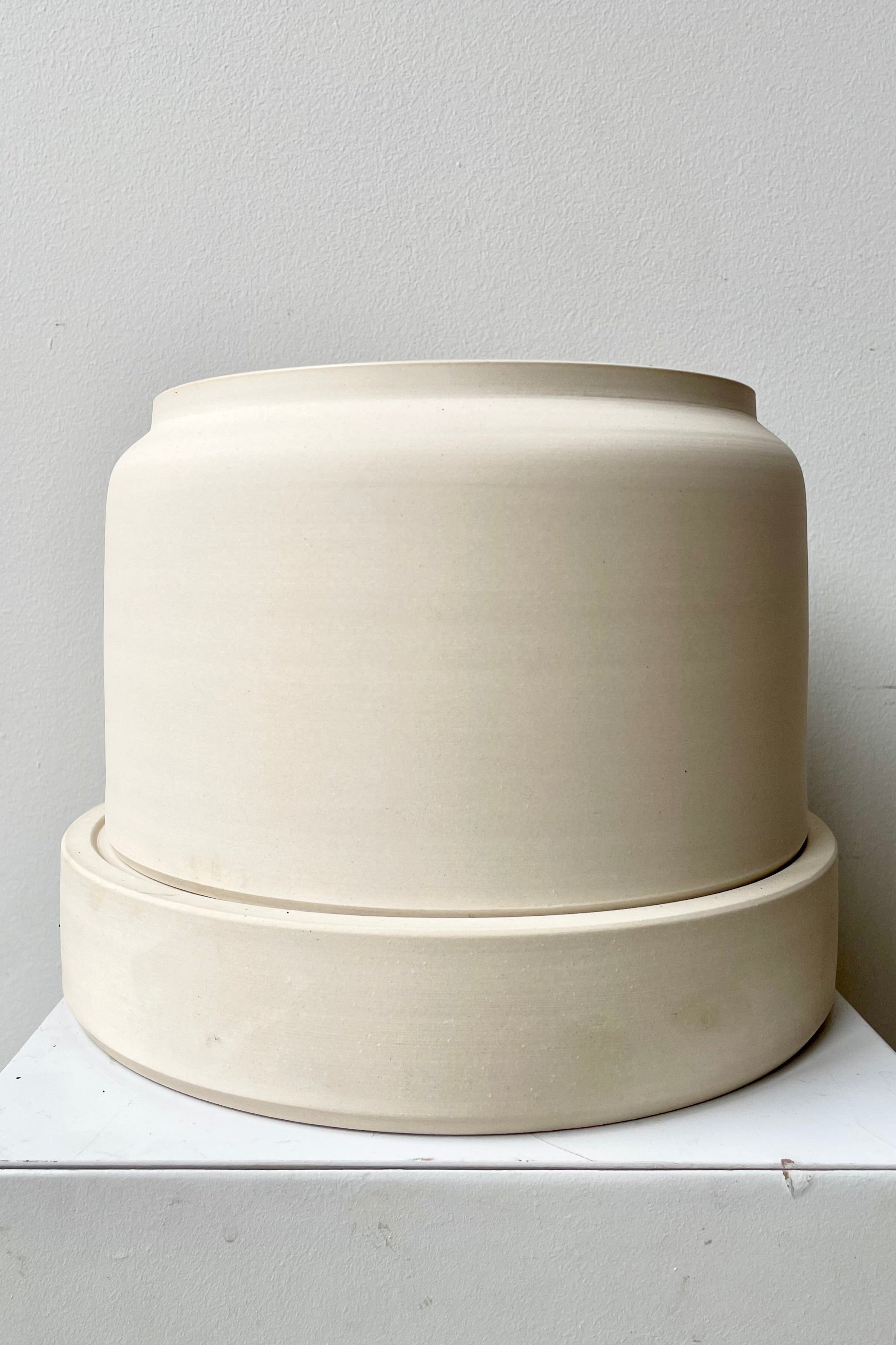The white wide self watering planter at Sprout-home. 