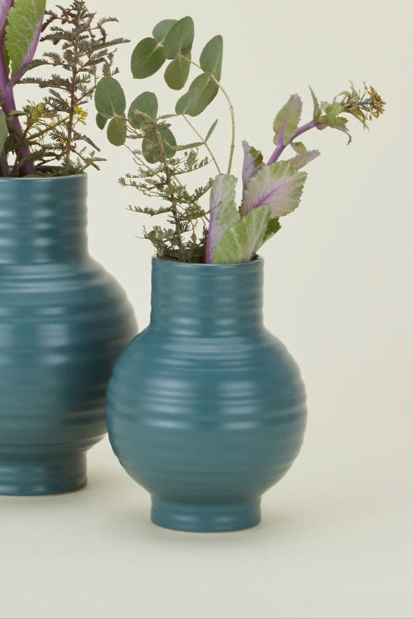 Hawkins New York Essential Peacock Ceramic Vases with ribbed texture and greens inside  on a beige background ©Hawkins New York