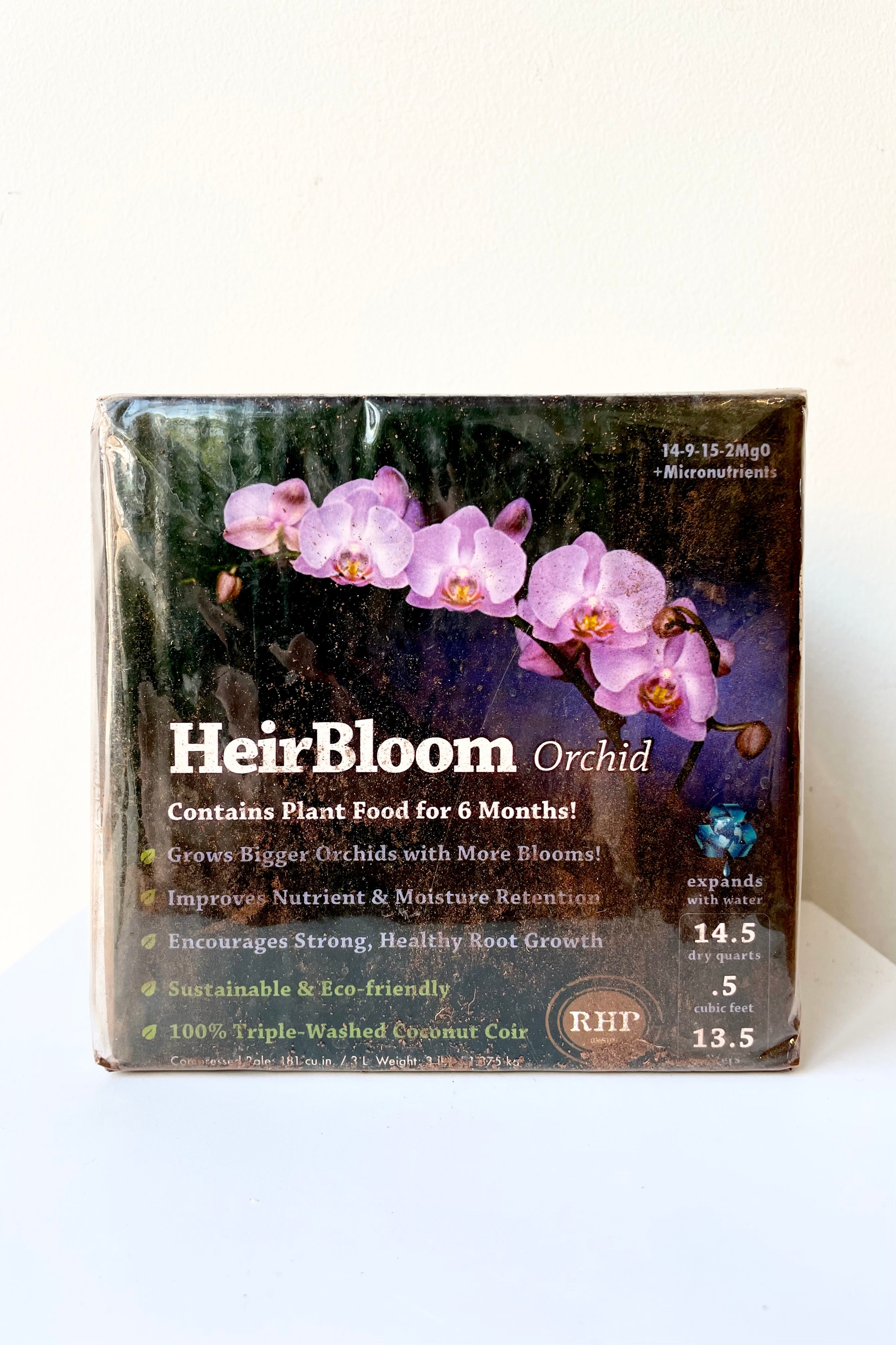 Orchid Coir Bale .5 cubic ft. against a white wall