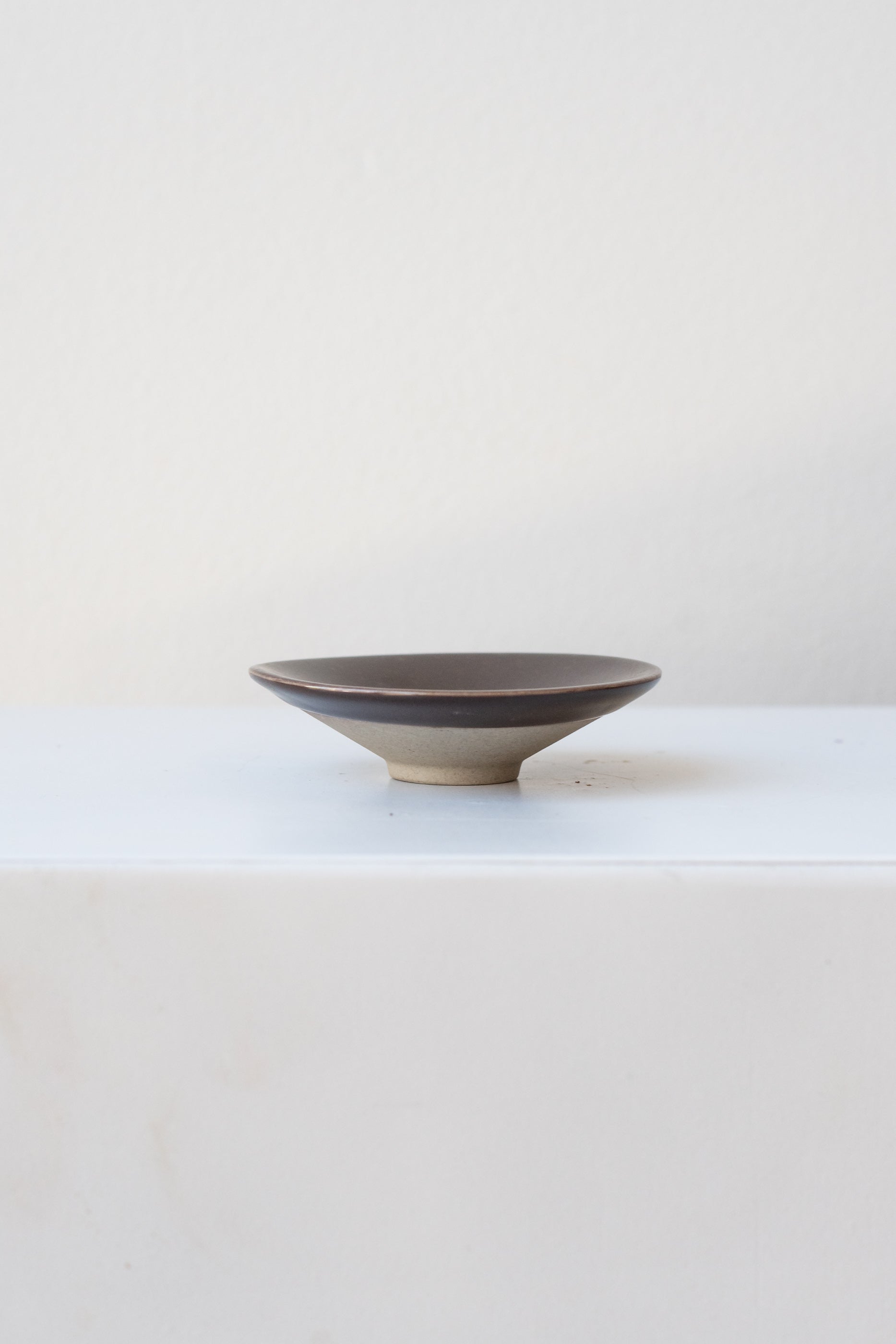 OYOY Living Design Hagi bowl brown mini on white surface in a white room