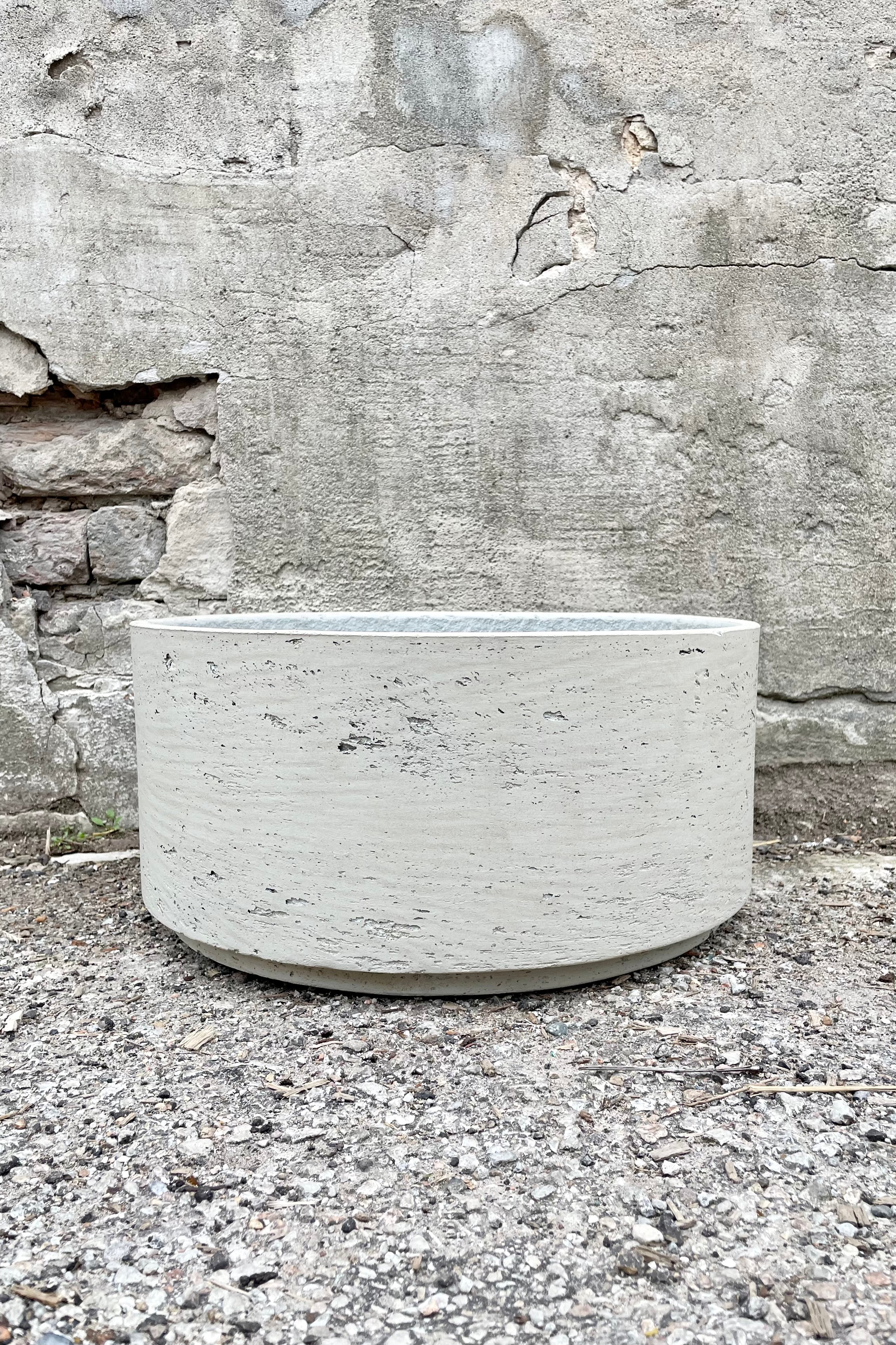 Eli Bowl grey washed large against a grey wall